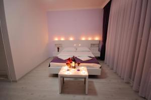 A bed or beds in a room at Fuda Hotel