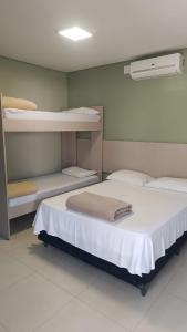 Cama ou camas em um quarto em Pousada Falls Park