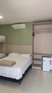 Cama ou camas em um quarto em Pousada Falls Park