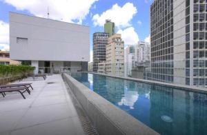 a swimming pool on the roof of a building at Loft Downtown São Luis, 612 in Sao Paulo