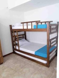 a pair of bunk beds in a room at Tucurinca in Santa Marta