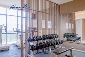 a gym with a row of dumbbells on a wall at Alviv 99 Suites I Family Suite I 4-7 pax I 5minsMelakaCruise I JonkerSt2 in Malacca