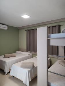 Cama ou camas em um quarto em Pousada Falls Park