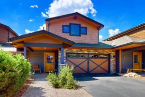 a house with a garage and a driveway at Running Bear in the Rockies #6145 in Estes Park