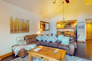 a living room with a couch and a table at Running Bear in the Rockies #6145 in Estes Park