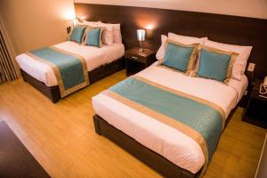Cama ou camas em um quarto em Hotel Diamond Lima