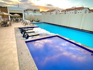 Bazén v ubytování Lua Nova - Vog Acqua Apt na Praia dos Milionários nebo v jeho okolí