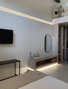 TV a/nebo společenská místnost v ubytování Pnoe Eco Residences
