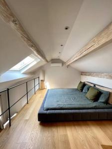 a bedroom with a bed in the middle of a room at La Perla di Boccadasse in Genoa