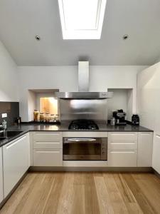 a kitchen with a stainless steel stove top oven at La Perla di Boccadasse in Genova