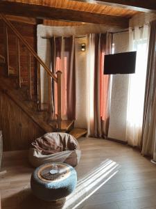 a living room with a tire on the floor at Hotel Nordmann,Racha in Ambrolauri