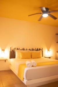 Postel nebo postele na pokoji v ubytování Hotelito El Cuyo