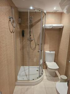 a bathroom with a shower and a toilet at Mataro Luxury Apartments in Mataró