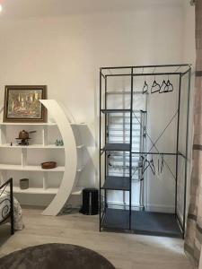 a room with a glass shelf and a stair case at Cosy Apartment In paris in Saint-Ouen