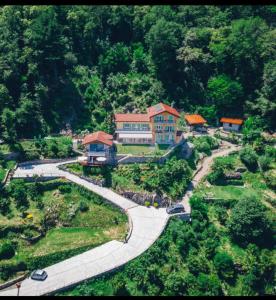 an aerial view of a house in the middle of a park at B&B Lago Maggiore in Cannobio