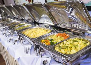 a row of trays of food on a table at Grand Lubicz Uzdrowisko Ustka in Ustka