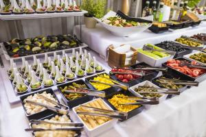 a buffet line with many different types of food at Grand Lubicz Uzdrowisko Ustka in Ustka