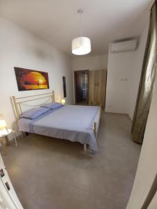 Кровать или кровати в номере CA'RINA HOUSE