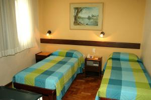 Cama ou camas em um quarto em Hotel São Bento