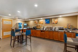 a fast food restaurant with a counter and chairs at Comfort Inn Arcata in Arcata