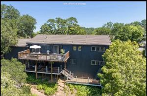 an aerial view of a blue house with a deck at Resort Living in Novato