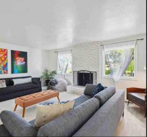 a living room with a couch and a fireplace at Resort Living in Novato