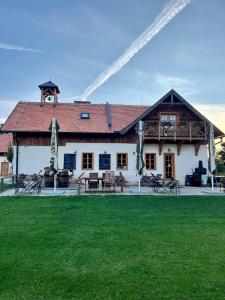 a building with a fountain in the middle of a yard at Zámeček - Chateau Lány in Břeclav