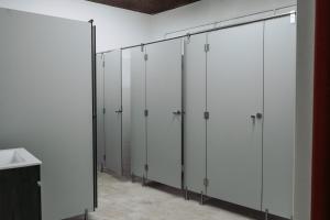 a row of white lockers in a room at Hostel Middle Point in Sardoal