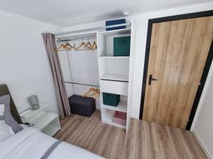Ένα ή περισσότερα κρεβάτια σε δωμάτιο στο Résidence cosy et moderne