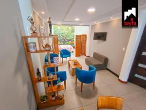 TV a/nebo společenská místnost v ubytování TEYFA Hospedaje - Edificio