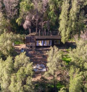 a house in the middle of a forest at Casa clara San Alfonso in San Alfonso