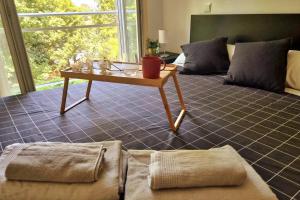 a living room with a table and a couch at Apartamento en Gama (Bárcena de Cicero) in Gama