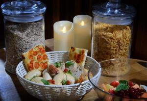 a table with two baskets of food and candles at The Birley Arms Hotel Warton in Lytham St Annes