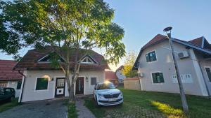 a car parked in front of a house at Office Escape - holiday home in Terme Čatež in Brežice