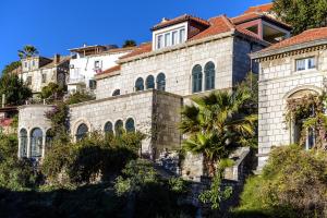 a house on the side of a hill at Villa Mediteran Old Town, 5 En-Suites and Hot Tub in Dubrovnik