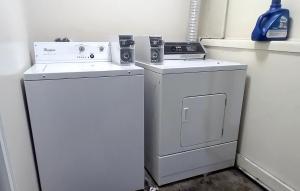 a washing machine and a washer in a room at 410 E 45th ave Unit 3 in Anchorage +28 photos