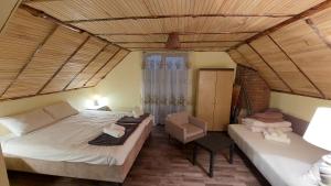 Un pat sau paturi într-o cameră la Vikendica Ristic