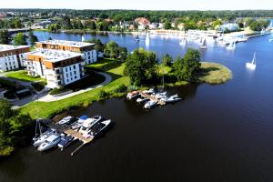 an aerial view of a marina with boats in the water at Port View plus miejsce w hali garażowej in Iława