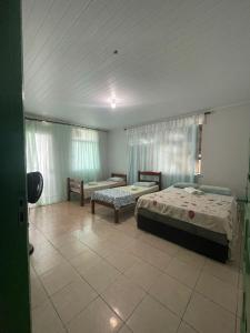 Postel nebo postele na pokoji v ubytování Hostel Areia Mar