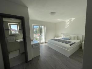 En eller flere senge i et værelse på Apartman Vieler Sterne