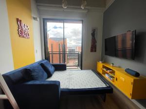 TV in/ali zabaviščno središče v nastanitvi Loft en Chapinero con todo lo que necesitas !