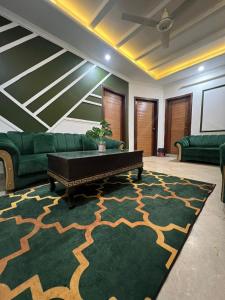 a living room with a couch and a table at Balcony View/Aesthetic One bedroom Apartment in Islamabad