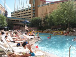 a group of people sitting in a swimming pool at Pleasant Unit at New York New York Strip Las Vegas in Las Vegas