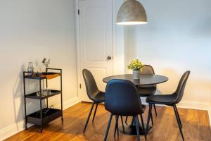 a dining room with a table and four chairs at Cottonwood Heights - Lower Level of Mountain Home! in Cottonwood Heights