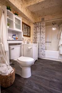 a bathroom with a white toilet and a shower at Pine Mountain Club Family Vacation House in Pine Mountain Club