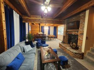 a living room with a couch and a fireplace at Pine Mountain Club Family Vacation House in Pine Mountain Club