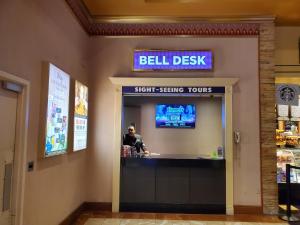 a man at a cash register in a store at Comfy Unit at Orleans Casino Strip Las Vegas in Las Vegas