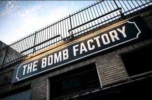 a building with a sign for the bomb factory at Downtown Dallas 2bd free parking in Dallas