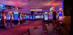 a casino with lots of slot machines and tables at Restful Unit at Mirage Casino Strip Las Vegas in Las Vegas