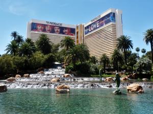 a man standing in front of a fountain in front of a hotel at Restful Unit at Mirage Casino Strip Las Vegas in Las Vegas